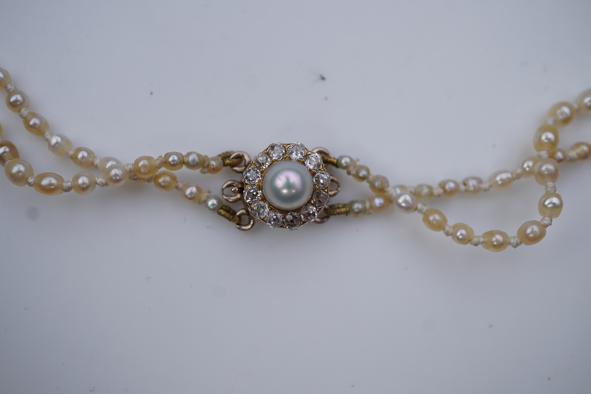 A natural pearl and diamond necklace, early 20th century